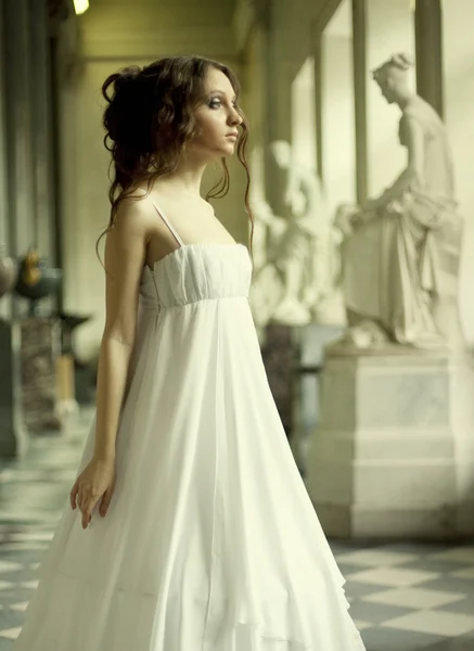 Beautiful young victorian lady in white dress — Stock Photo, Image