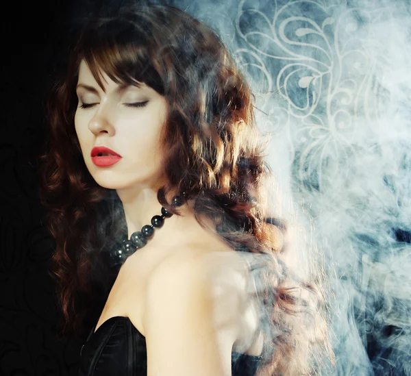 Young and sexy woman in smoke — Stock Photo, Image