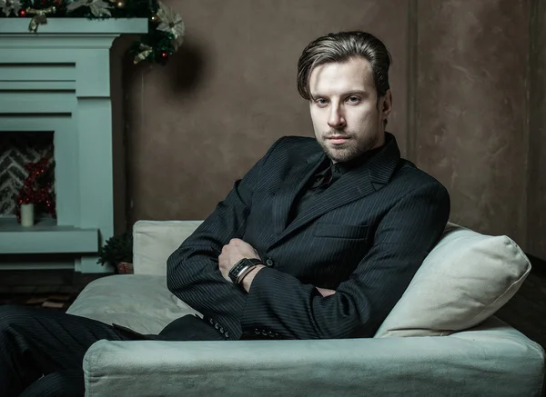 Businessman sitting on an armchair — Stock Photo, Image