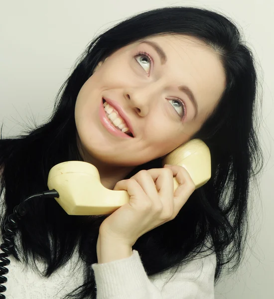 Young happy woman with vintage phone — Stock Photo, Image