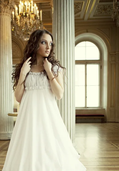 Beautiful young victorian lady in white dress — Stock Photo, Image