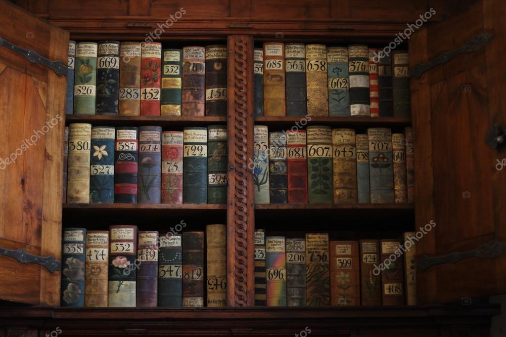 Old books on a medieval bookshelf — Stock Photo © kanareva 66206319