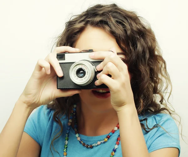 Young curly woman with vintage camera — Stock Photo, Image