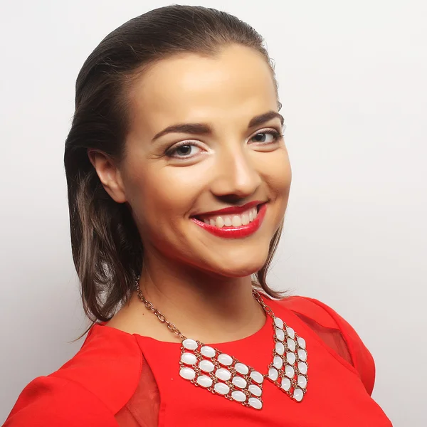 Young happy woman in red dress — Stock Photo, Image