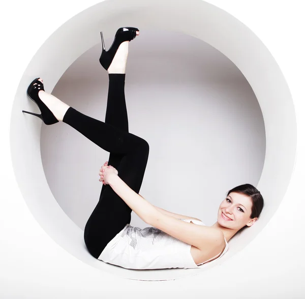 Young woman posing  in a circle — Stock Photo, Image