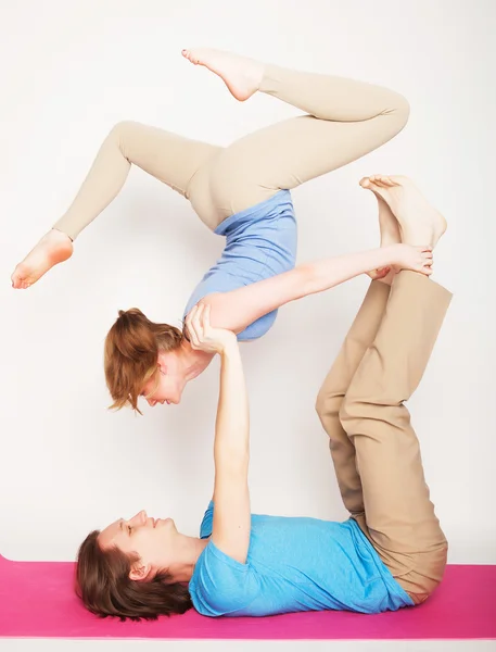 Young couple in yoga pose — Stock Photo, Image