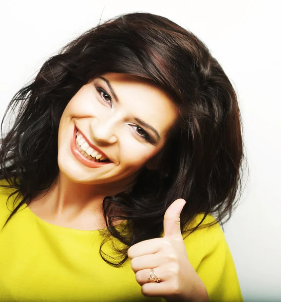 Young woman showing thumbs up gesture — Stock Photo, Image