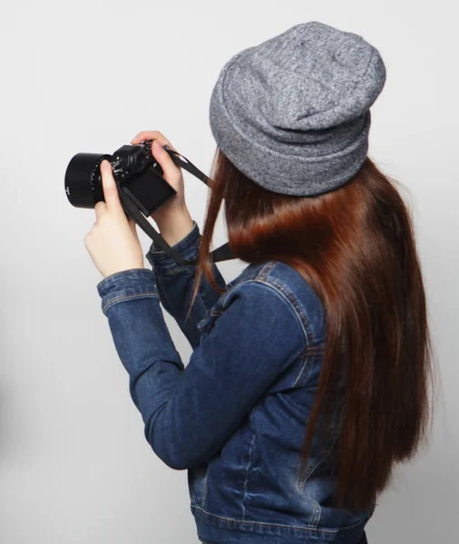 Beautiful young woman with camera — Stock Photo, Image