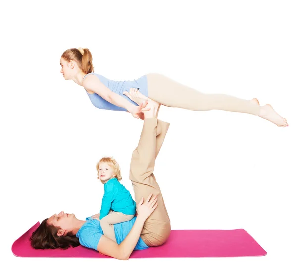 Mother, father and son doing yoga — Stock Photo, Image