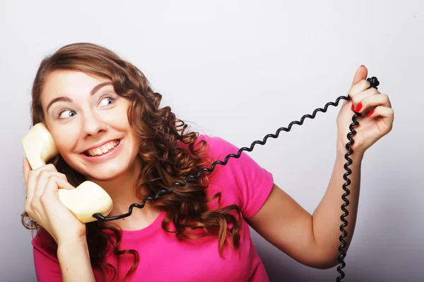 Young happy woman with vintage phone — Stock Photo, Image