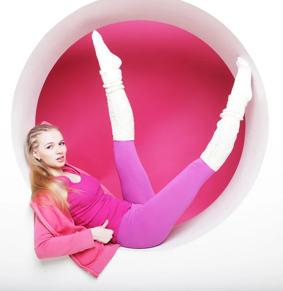 Sporty woman posing in pink circle — Stock Photo, Image