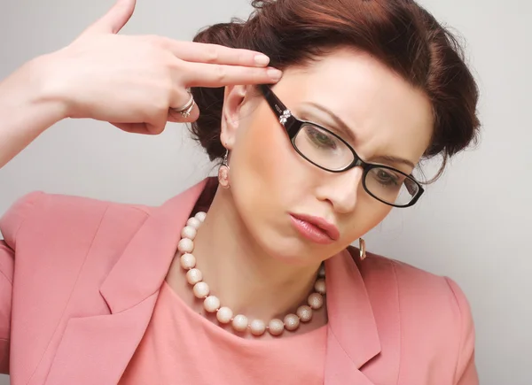 Young businesswoman in pink wearing glasses. — Stock Photo, Image