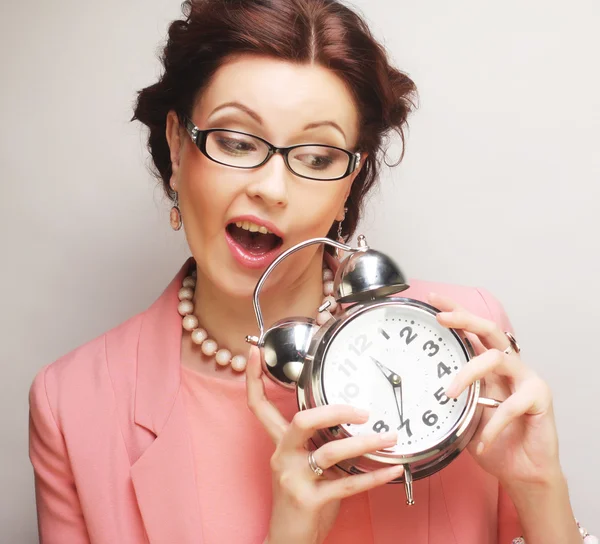 Fun businesswoman with alarmclock — Stock Photo, Image