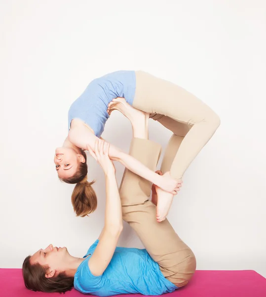 Young couple in yoga pose — Stock Photo, Image