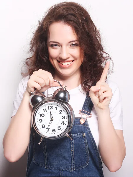 Young woman with alarmclock — Stock Photo, Image