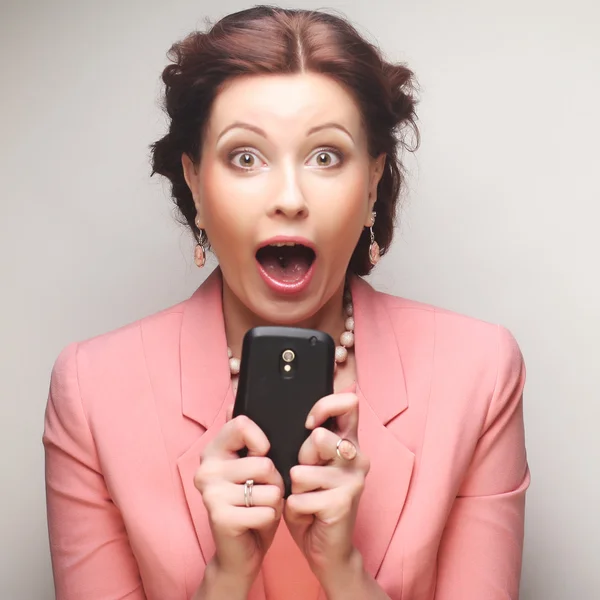 Funny businesswoman with mobile — Stock Photo, Image