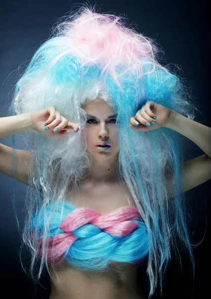 fashion model with bright make up and colorful hair