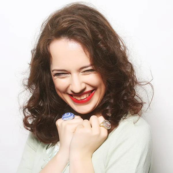 Beautiful young surprised curly woman. — Stock Photo, Image