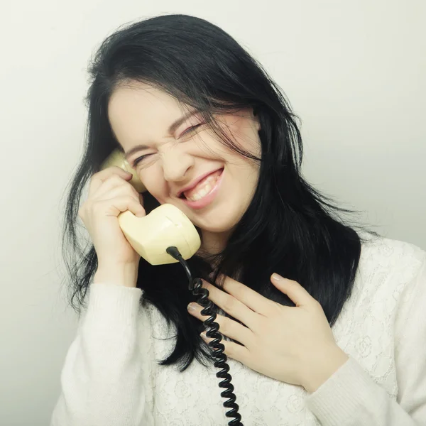 Young happy woman with vintage phone — Stock Photo, Image