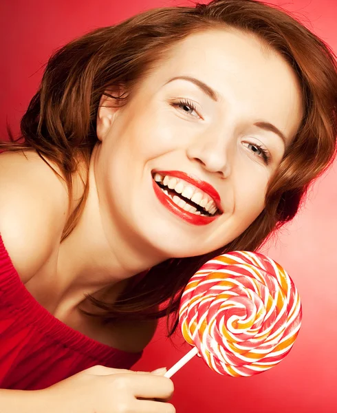 Portrait of young woman with lollipop — Stock Photo, Image