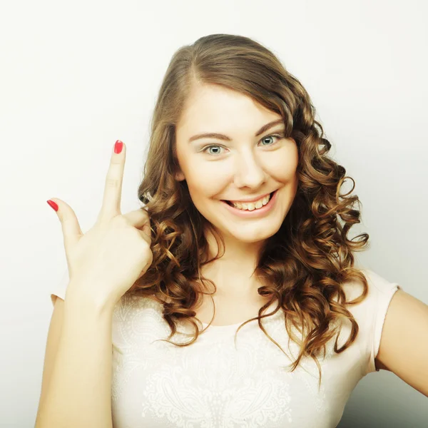 Woman with her finger up — Stock Photo, Image