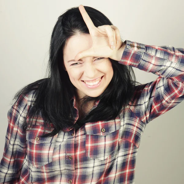 Woman with her finger up — Stock Photo, Image