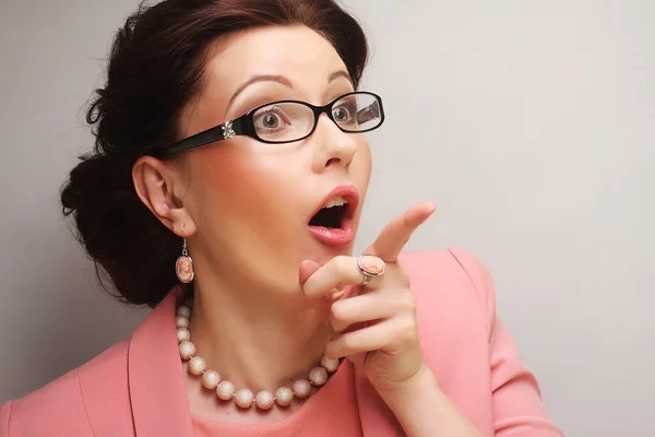 Young businesswoman in pink wearing glasses. — Stock Photo, Image