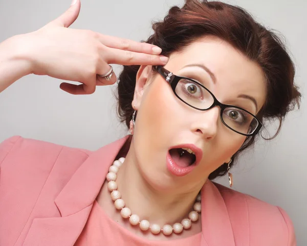 Young businesswoman in pink wearing glasses. — Stock Photo, Image