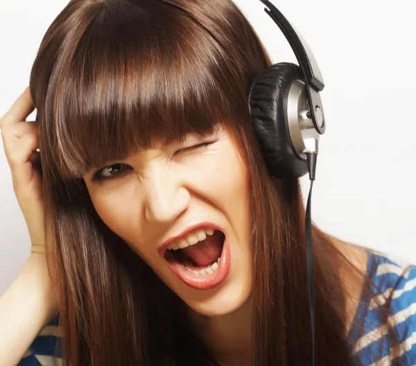 Joven mujer feliz con auriculares —  Fotos de Stock