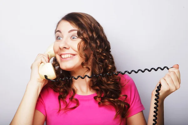 Furious girl with vintage phone — Stock Photo, Image