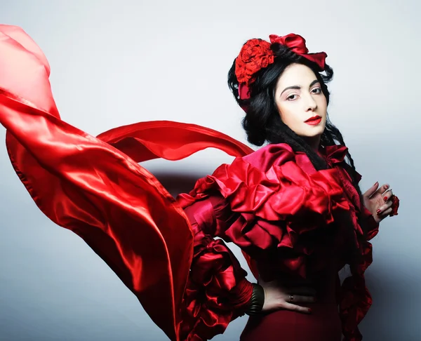 Mujer en traje rojo elegancia con sombrero rojo . —  Fotos de Stock