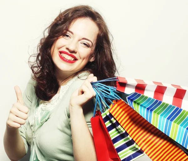 Mujer con bolsas de compras de colores —  Fotos de Stock