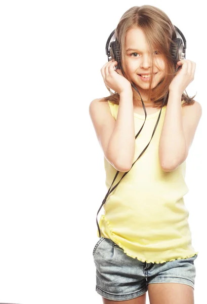 The girl is holding the headphones — Stock Photo, Image