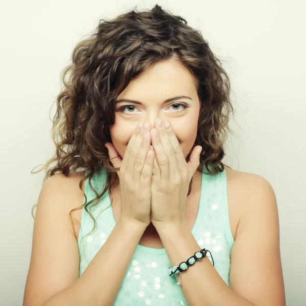 Beautiful young woman covering the face with her hand — Stock Photo, Image