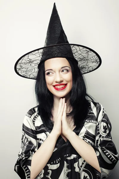 Funny Witch. Young happy woman with canival hat. — Stock Photo, Image