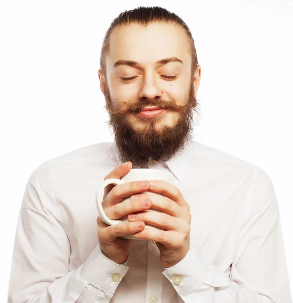 Ung mand drikker en kop kaffe - Stock-foto