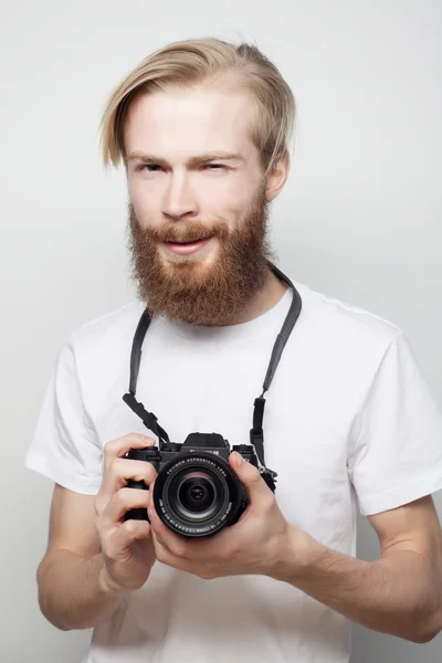 Bearded man with a digital camera — Stock Photo, Image