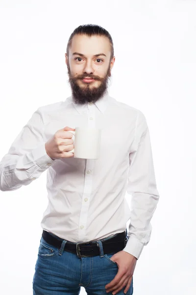 Young man drinking a cup of coffee — Stock Photo, Image