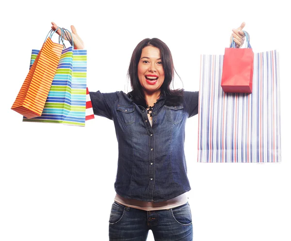 Happy brunette woman with shopping bags — Stock Photo, Image