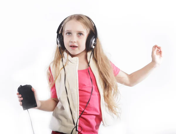 Tanzende kleine Mädchen Kopfhörer Musik singen — Stockfoto