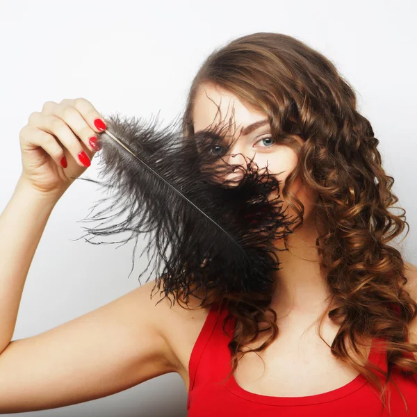 Casual woman with black  feather — Stock Photo, Image