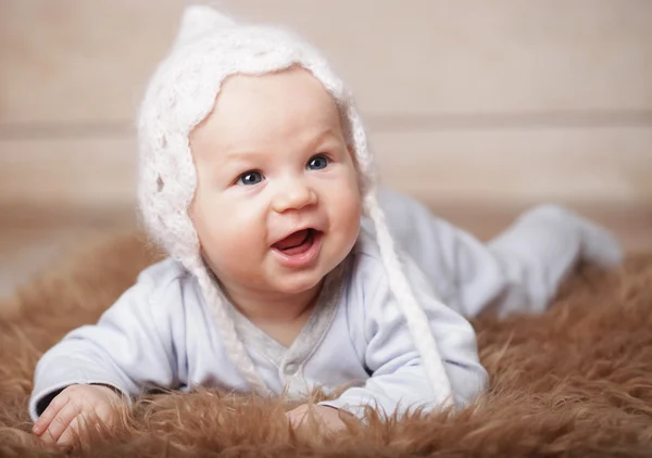 Adorable  baby in white hat — Stock Photo, Image