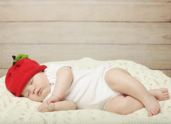 Dulce sueño de bebé en sombrero rojo —  Fotos de Stock