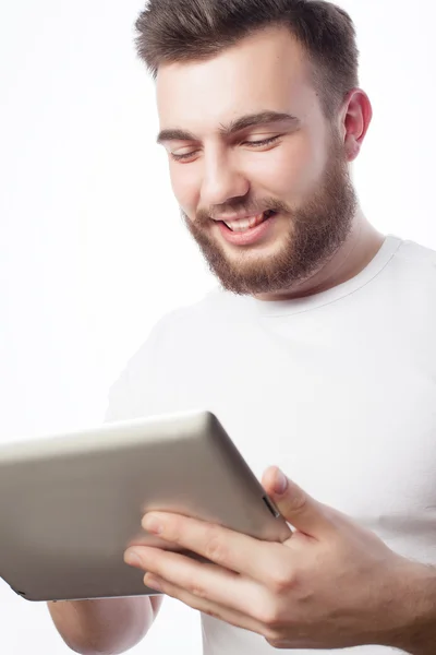 Young man  using a tablet computer — Stock Photo, Image