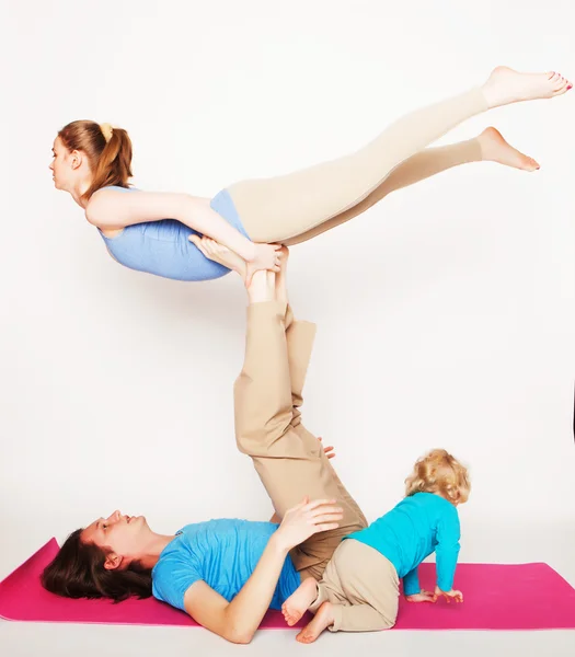 Mother, father and son doing yoga — Stock Photo, Image