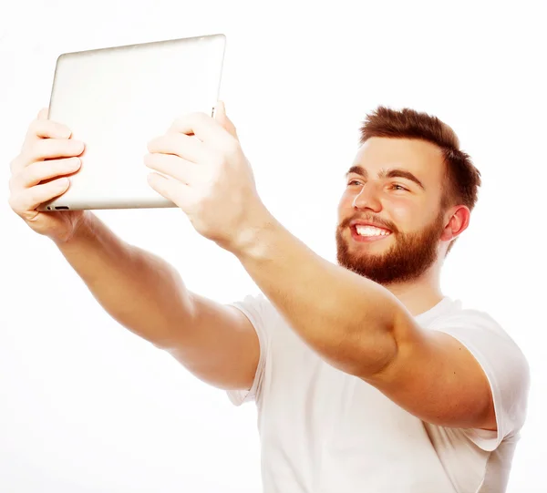 Young bearded man holding tablet — Stock Photo, Image