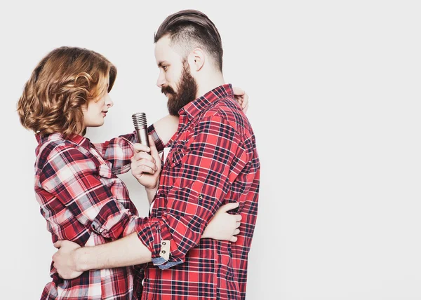 Lovely couple with microphone — Stock Photo, Image