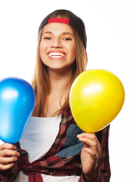 Bederní dívky, usmíval se a drží barevné balónky — Stock fotografie
