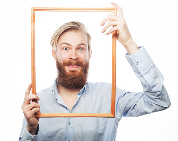 Young man holding picture frame