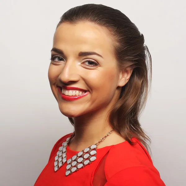 Young happy woman in red dress — Stock Photo, Image